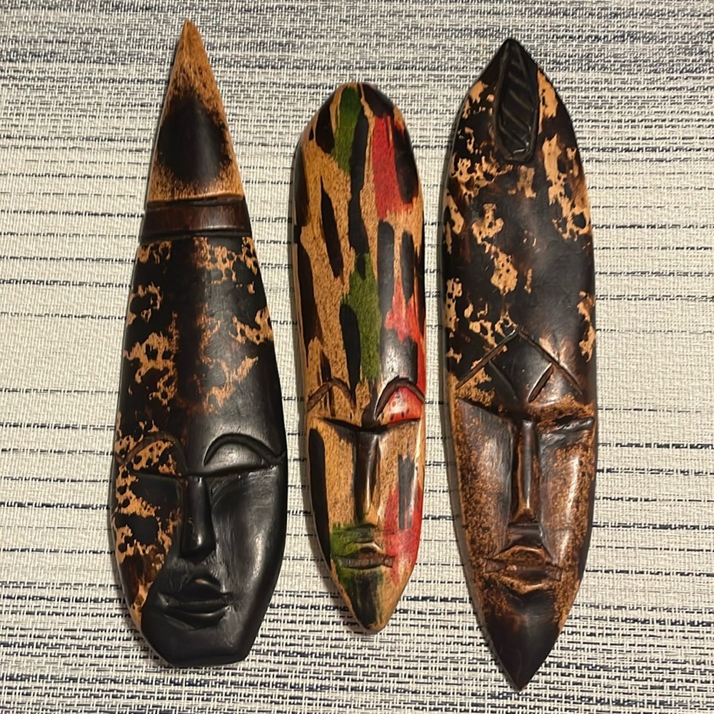 3 small African Wood Carved Masks-2 are black, brown & tan colored.